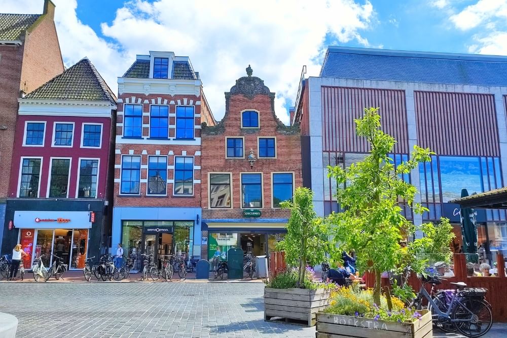 Early morning light of stores at Waagplein along the route of the Leeuwarden scavenger hunt City Detective.