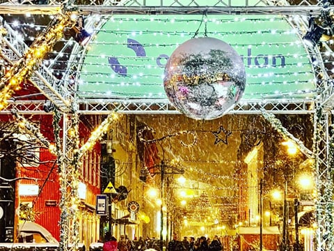 A well lit and decorated street in Reykjavik around Christmas time