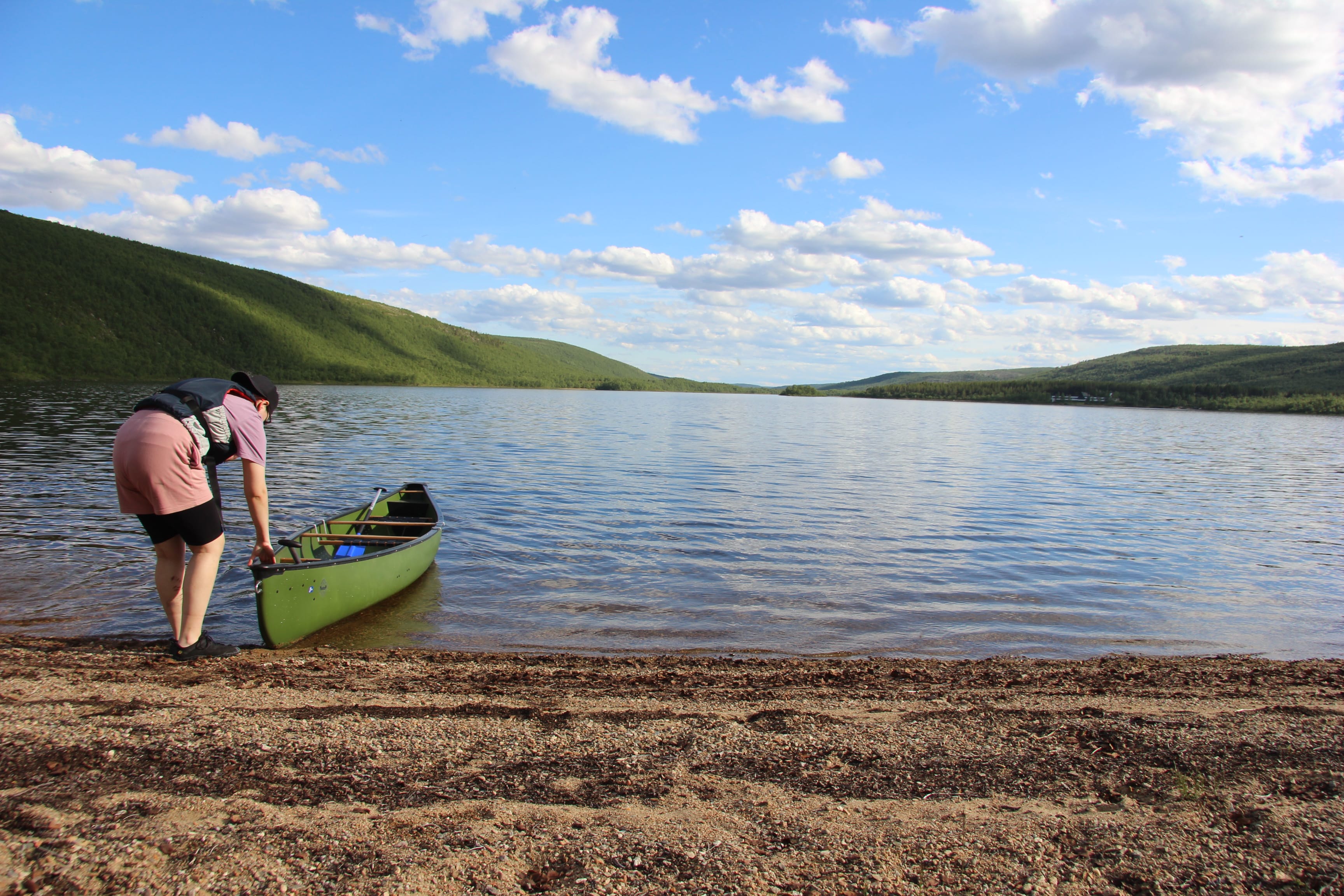 Canoe on beach in Utsjoki Mantojärvi lake.