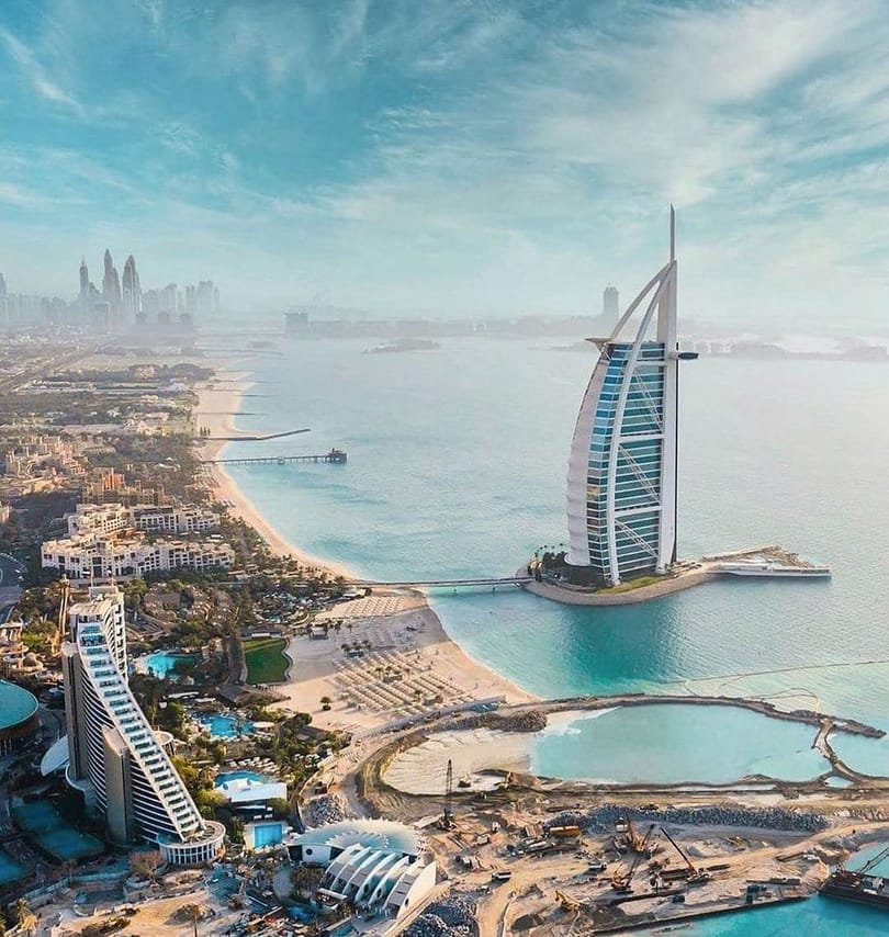"Architectural marvel: Burj Al Arab against the Arabian Gulf waters."