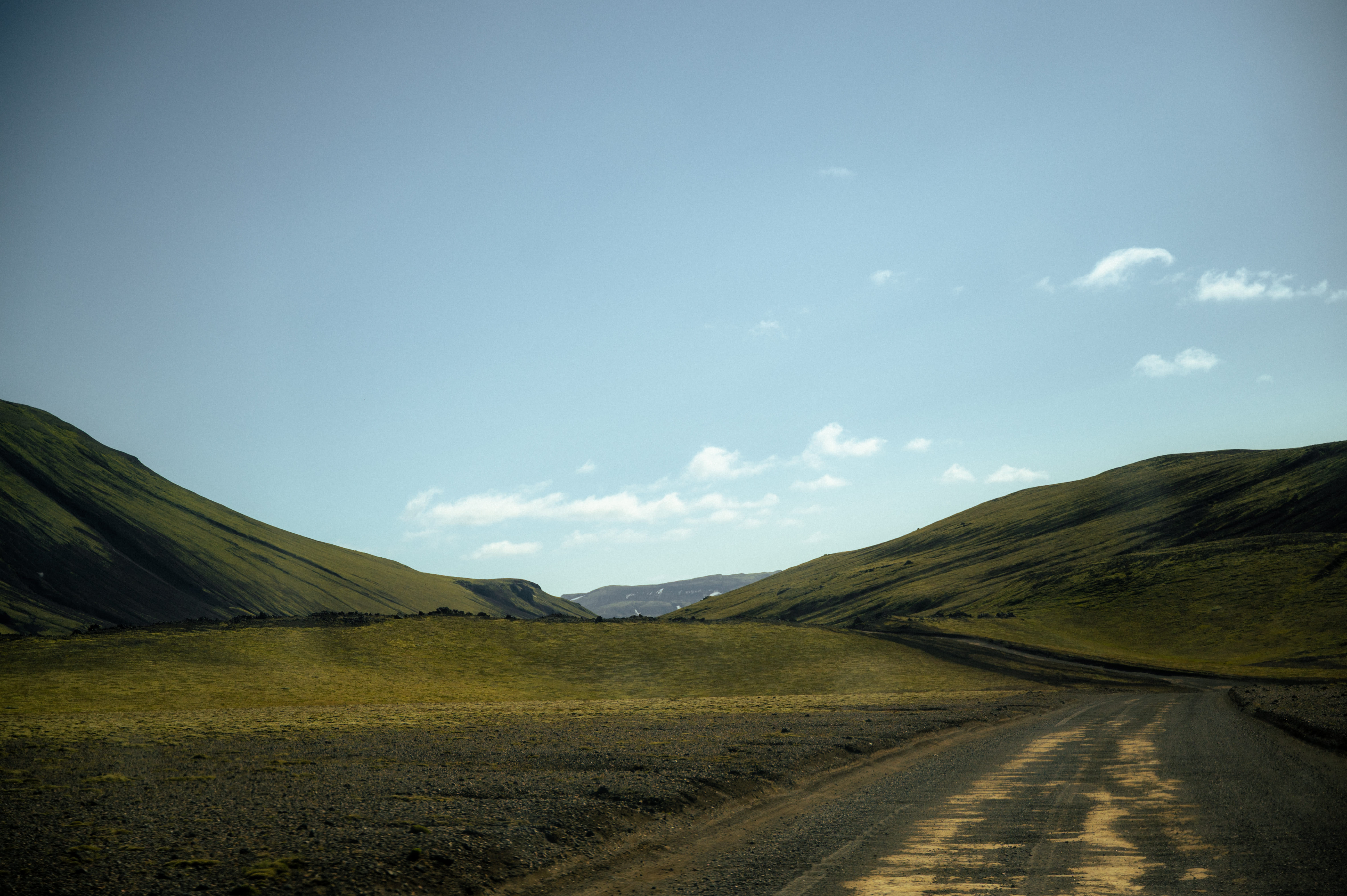 Driving on a remote gravel F-road through the vast uninhabited Icelandic interior