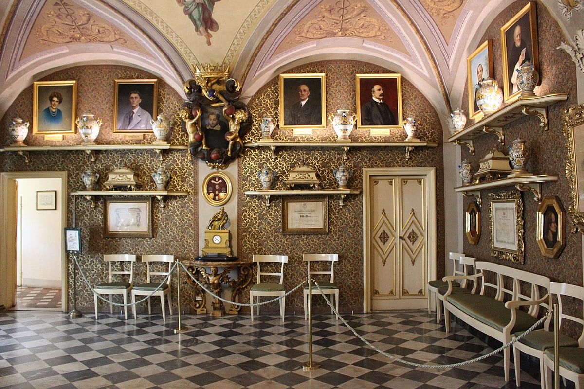 One of the halls of Officina Profumo-Farmaceutica Santa Maria Novella with paintings and artifacts on display 