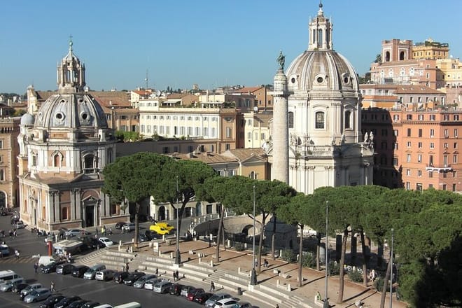 View from top the monument Altare della Patria with Traian's Column and Church of Saint Mary of Loreto