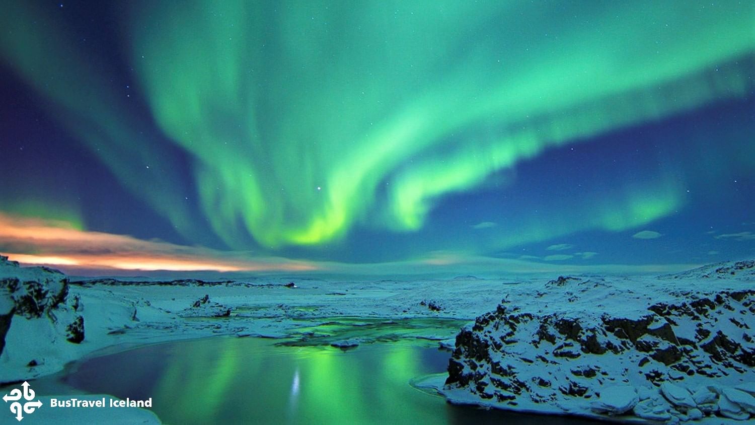 Beautiful green Northern lights over a lake in Iceland