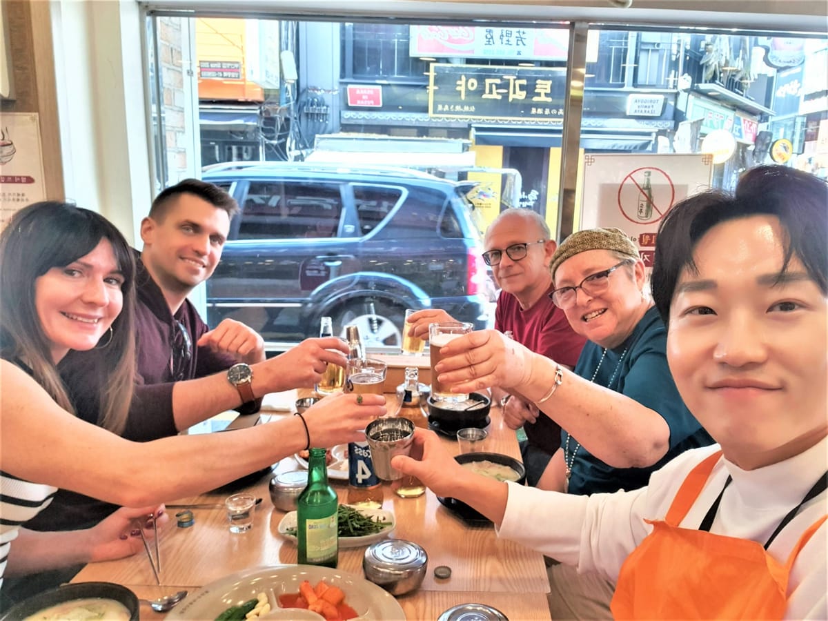 A joyful moment sharing drinks and laughter during the tour.