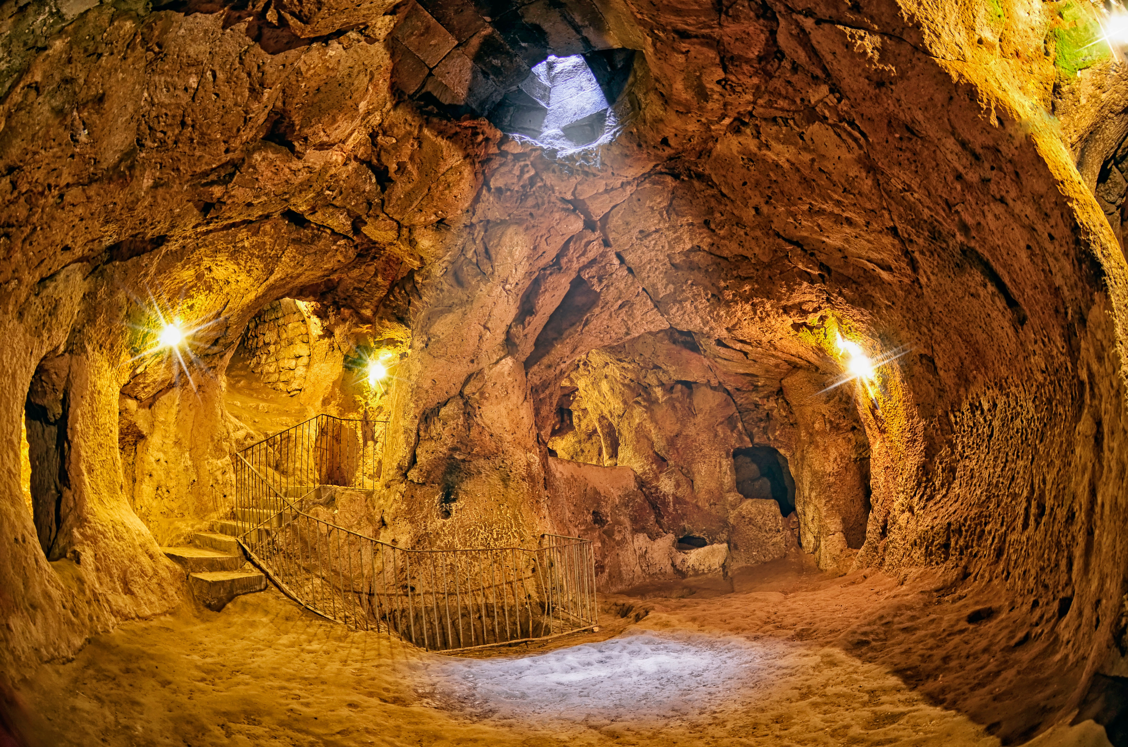 “Narrow passageways and stone walls inside the underground city of Derinkuyu, showcasing ancient cave architecture deep beneath Cappadocia.”