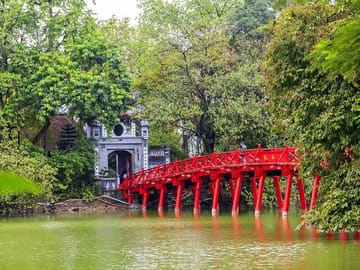 Red wooden bridge when linked the Temple to lake bank
