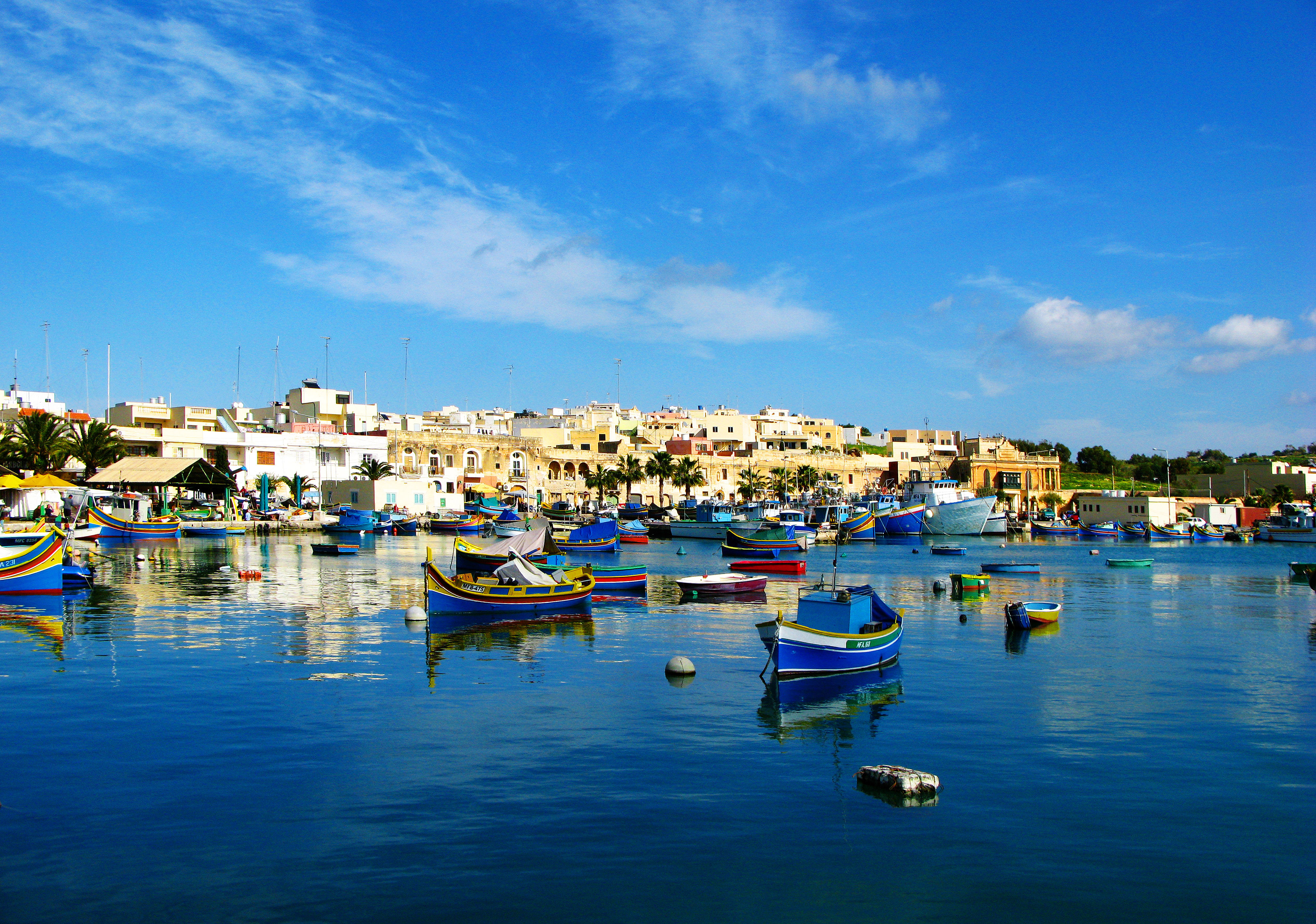 Colourful traditional fishing boats in Marsaxlokk, Malta
