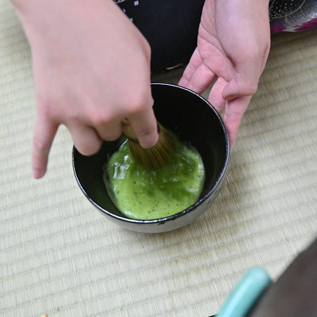 Matcha is prepared and served to entertain guests