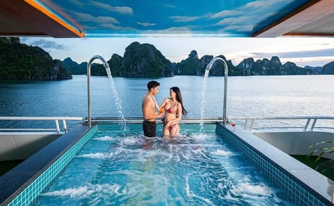 Halong Bay Carnival Cruise Kayak, Explore Caves, Lunch and Party
