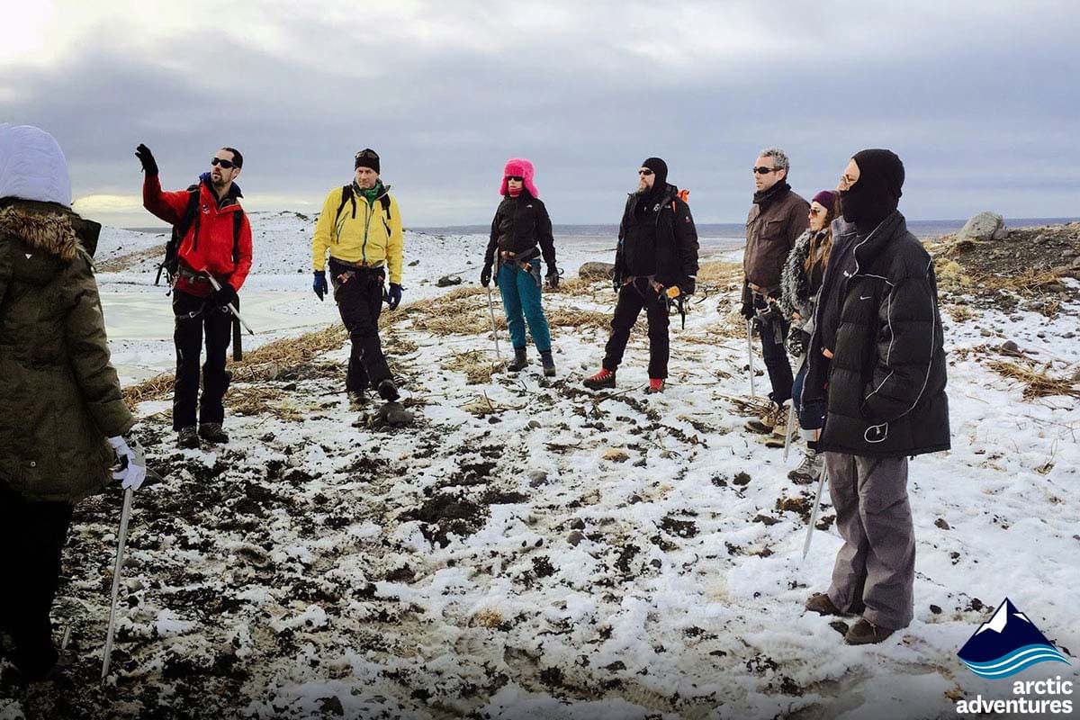 Small group are given a tour during  2 day south coast tour Iceland