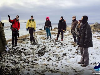 Small group are given a tour during  2 day south coast tour Iceland