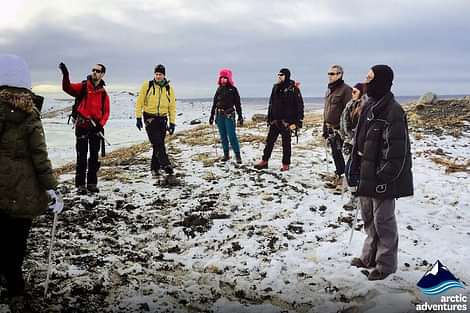 Small group are given a tour during  2 day south coast tour Iceland