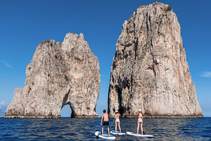 Capri: Faraglioni Rocks and Blue Grotto Paddleboarding Tour