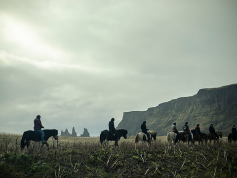 Horse riders enjoying the Icelandic horse near Reynisdrangar sea-stacks