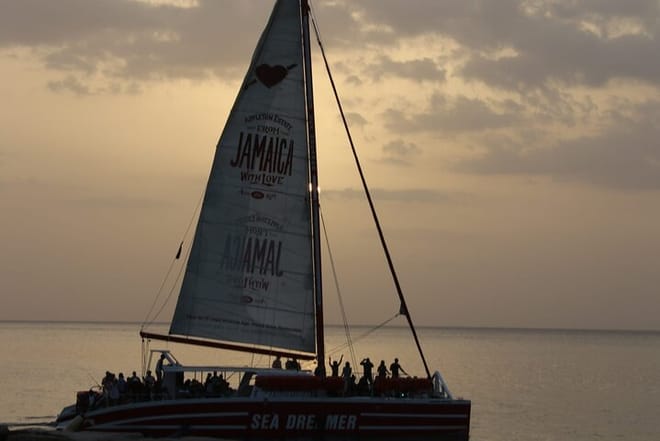 Sun-soaked fun! Join the party on a Montego Bay catamaran for snorkeling, an open bar, and a Reggae DJ.