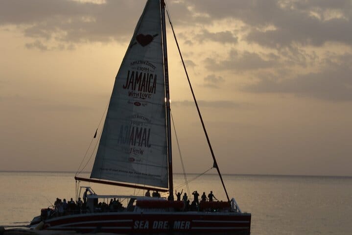 Sun-soaked fun! Join the party on a Montego Bay catamaran for snorkeling, an open bar, and a Reggae DJ.