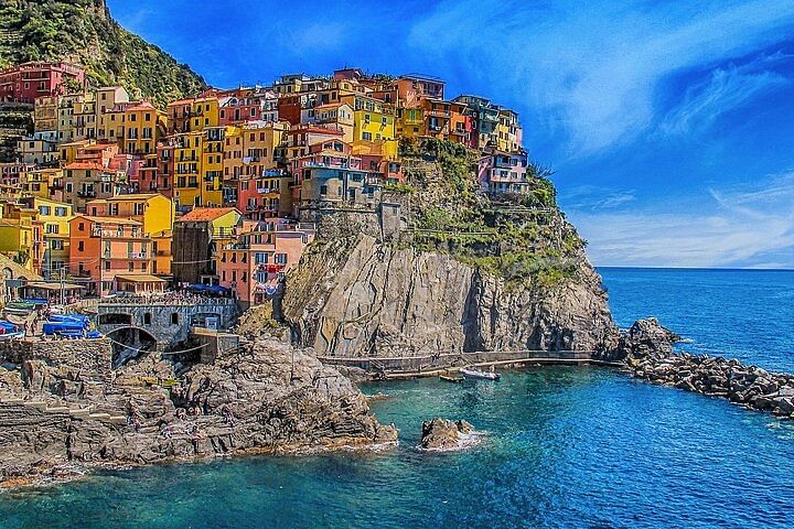 View of Manarola coastal village with its unique colourful houses and blue sea