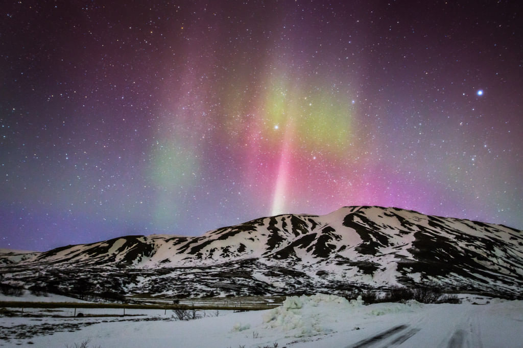 Northern Lights over Mountain In Iceland