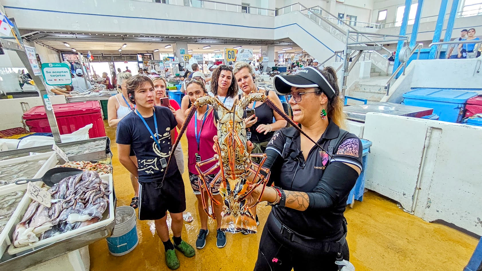 Elena holding a lobster at Panama City Seafood Market
