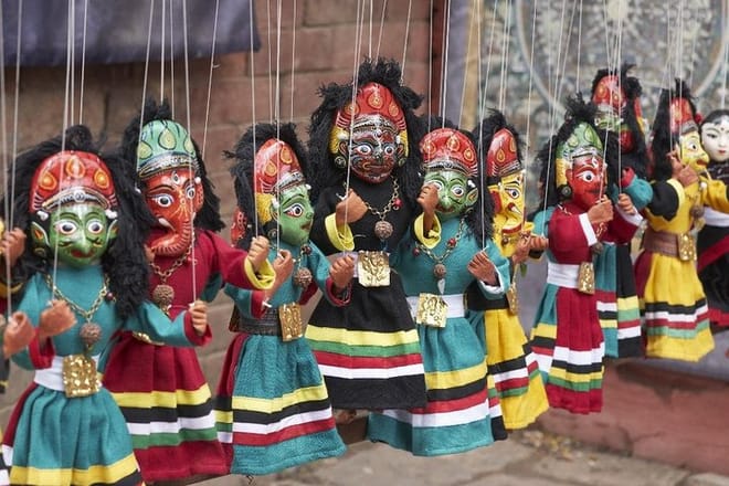 Colorful puppets on a market stall