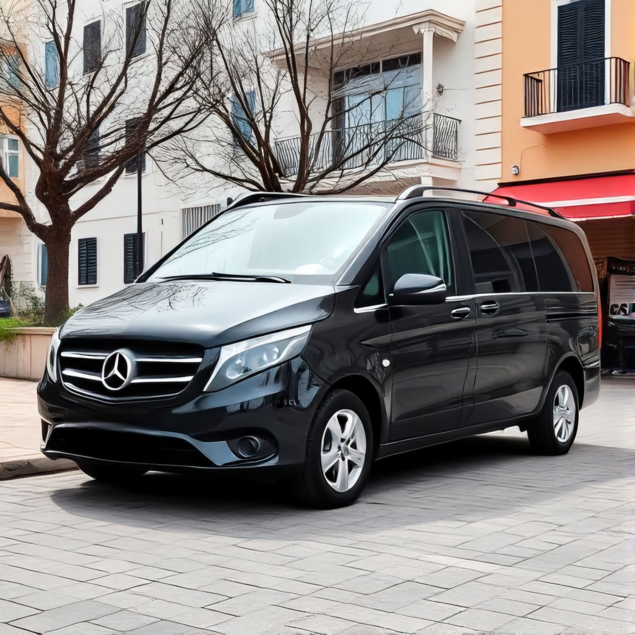 Luxury transfer dropping off passengers at a central Athens hotel