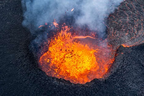 Volcanic crater bubbling with lava