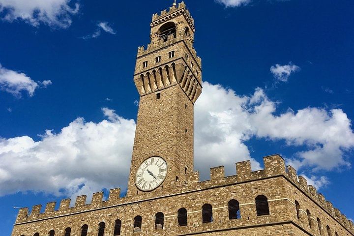 External view of Palazzo Vecchio with its distinctive merlons and the Tower of Arnolfo di Cambio
