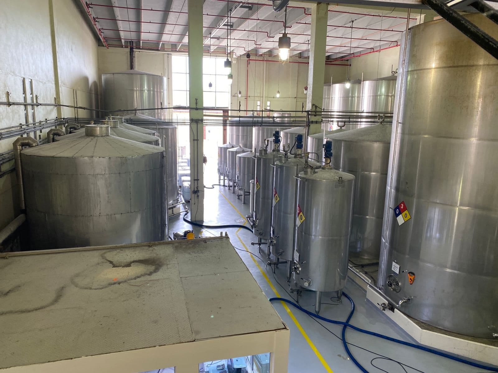 Distillery area with tanks and production equipment in the Ron Barceló Historic Center.