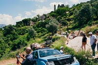 Jeep tour stop in Gornji Stoliv, Montenegro, where travelers explore a traditional hillside village with panoramic views over the Bay of Kotor.