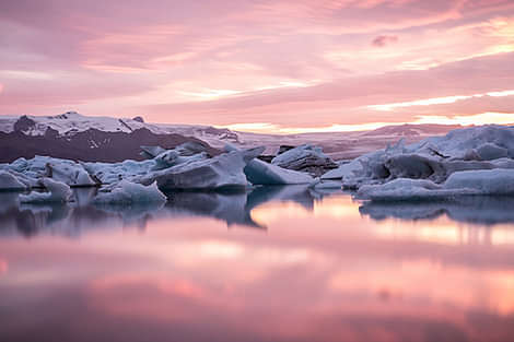 Sunset at the beautiful glacier lagoon with purple and pink colors