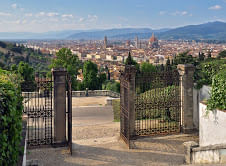 On the foreground the gates and staircase of San Miniato al Monte; on the back ground a panoramic view of Florence