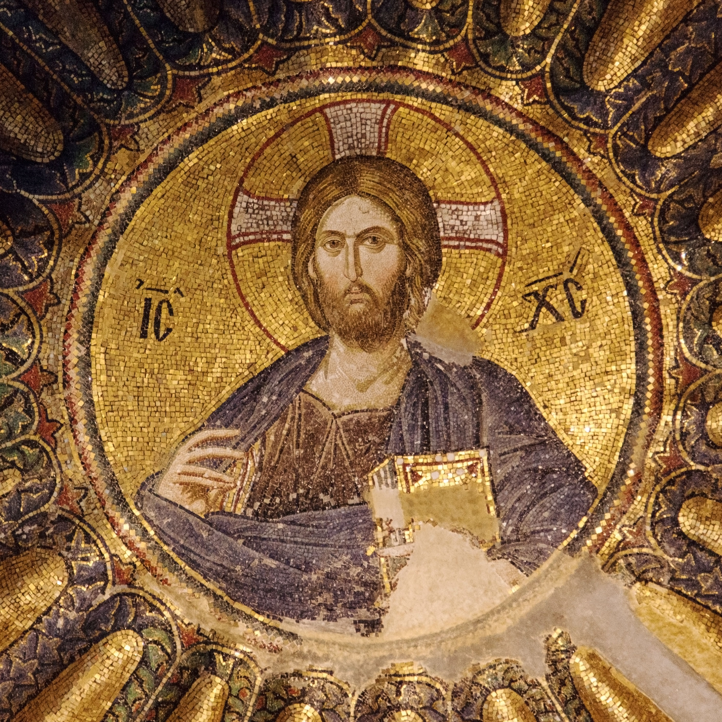 “Byzantine mosaic of Jesus Christ on the dome of Chora , featuring detailed gold and blue patterns with vibrant colors.”