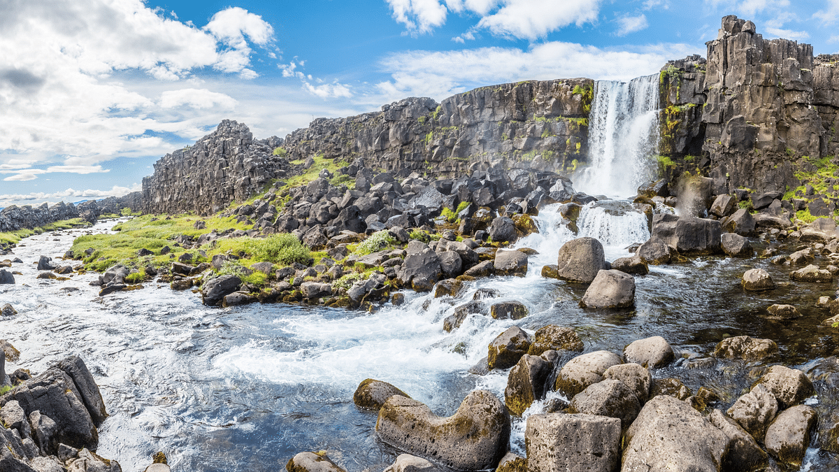 A small waterfall running into a creek.