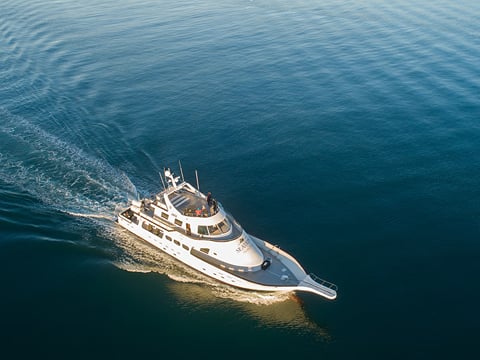 An aerial shot of a yacht at sea