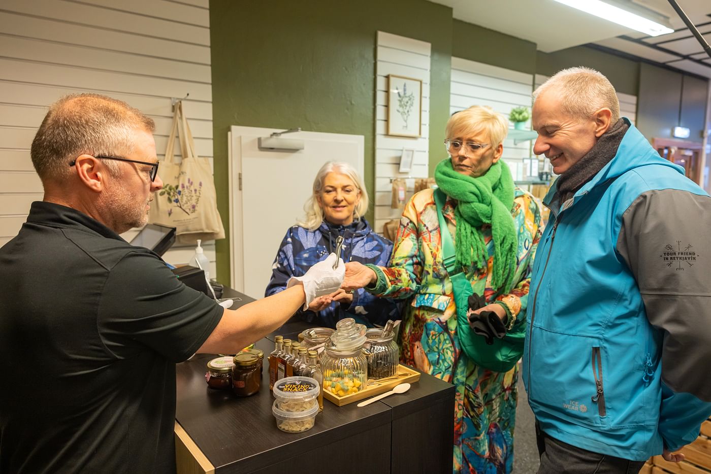 Travellers sampling different Icelandic specialities in downtown Reykjavik