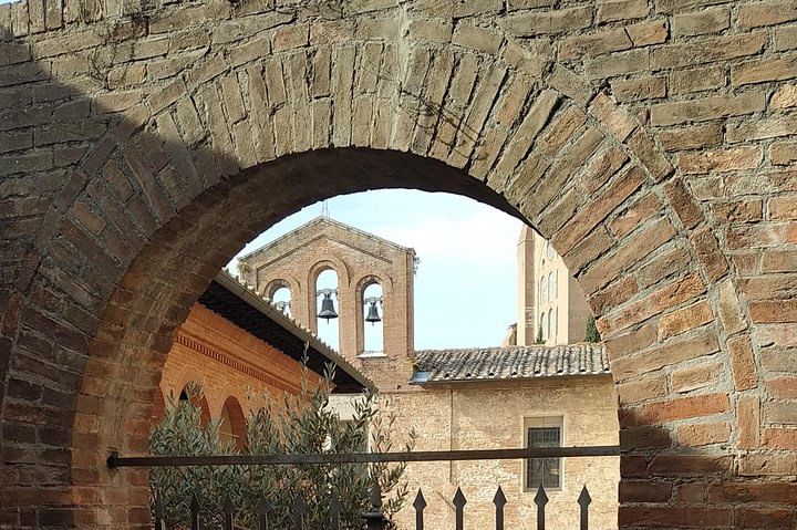 External view of a church and its BellTower in the Siena city centre 