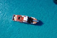 Ibiza Beach Hopper with Lunch Open Bar Paddle Surf and Snorkeling 1