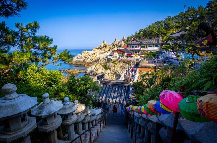 Temple buildings overlooking the rocky coastline at Haedong Yonggungsa.