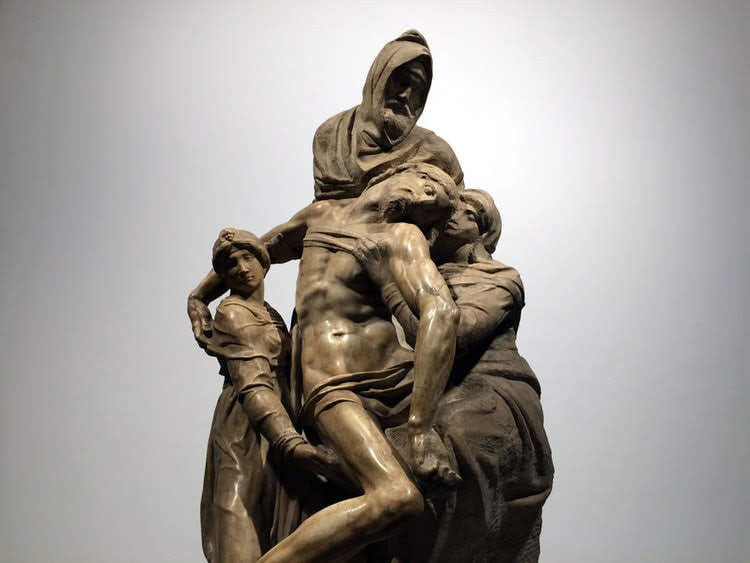 Close-up of the sculpture Pietà Bandini by Michelangelo on display in the Opera del Duomo Museum