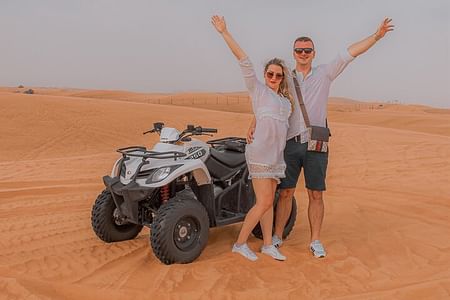 Morning Desert Safari in Dubai: Quad Bike Adventure, Sandboarding & Camel Ride