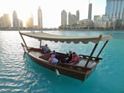 Evening view of the Dubai Fountains Show from the water.
