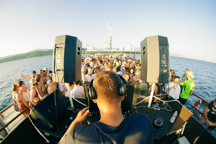 The DJ looking out over a packed deck