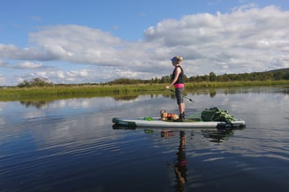 Arctic summer SUP boarding on a lake and river