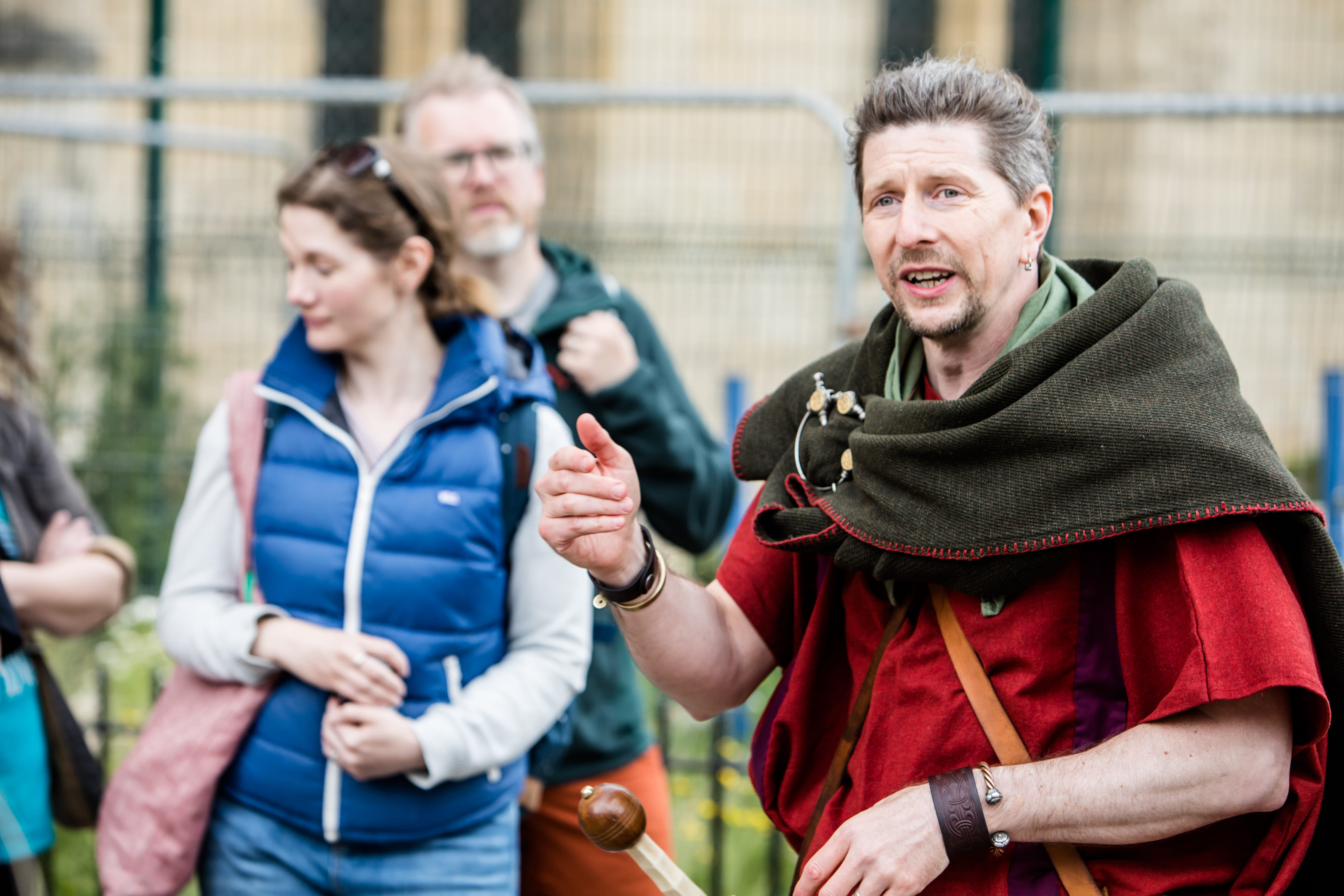 A Roman legionary stands besides the statue of Constantine the Great (out of frame), besides York Minster, with his crowd gathered around.