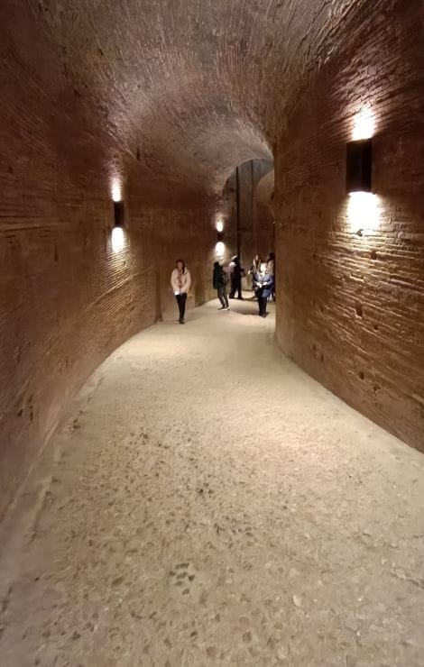 Walk the brick corridors of Castel Sant’Angelo, where footsteps echo and the air feels cool and hushed.
