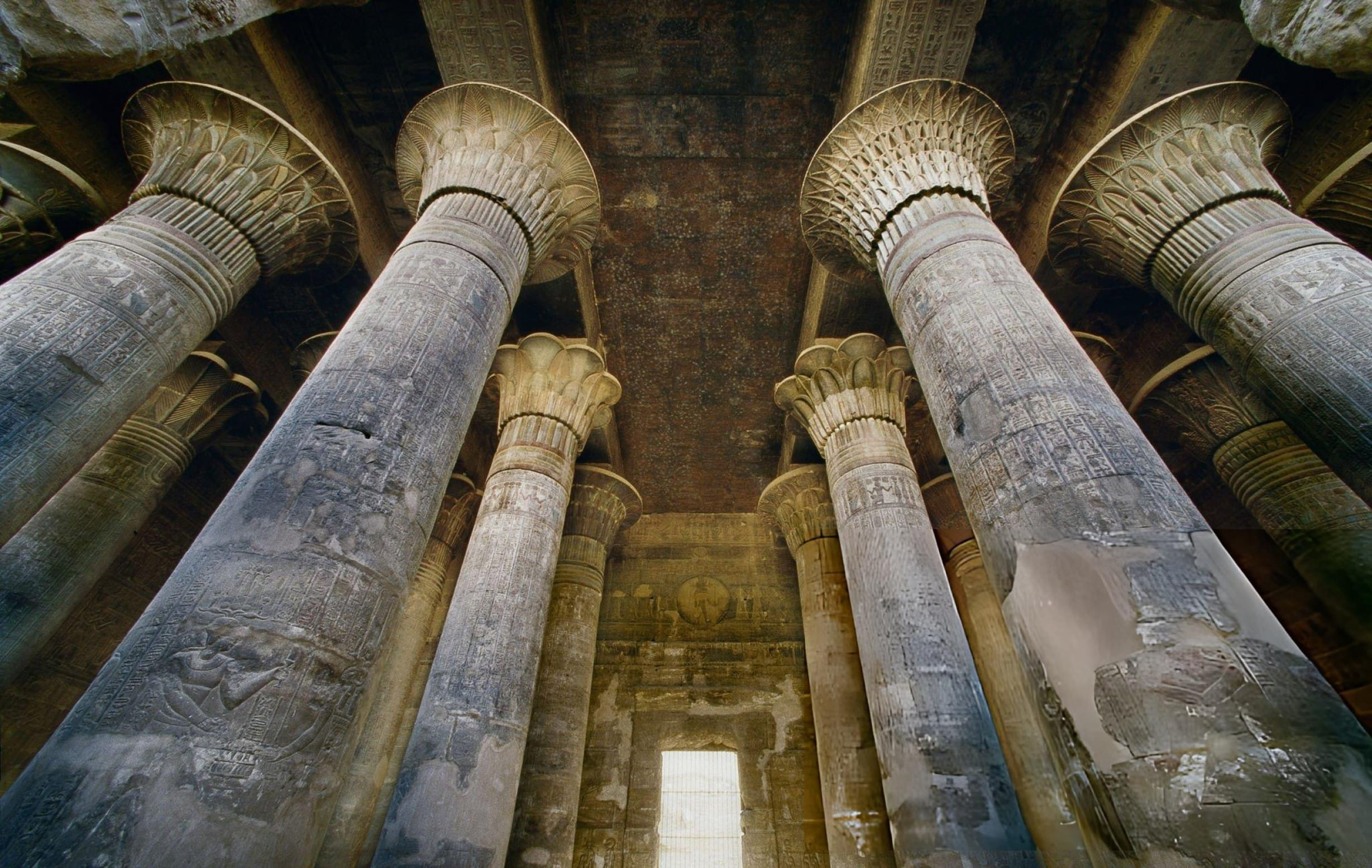Tall decorated columns inside the Temple of Khnum in Esna