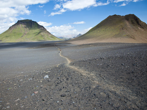 Wandering though a barren desert on the Laugavegur Volcano Trail. Photocredits: Alastair Humphries.