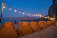 Unwind under the stars! Enjoy beach camping and a delicious BBQ Dinner after your Musandam Khasab Dhow Cruise.