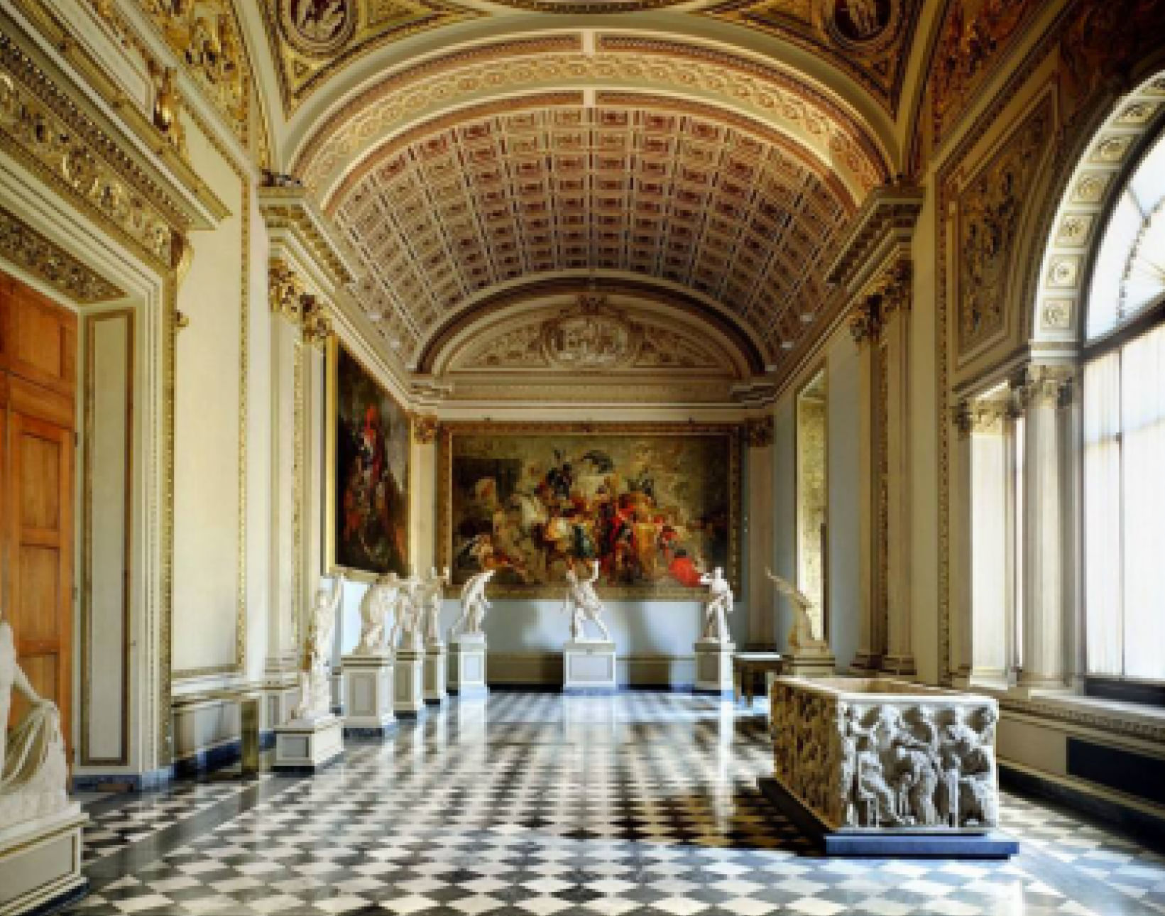 Sculptures and paintings on display in one of the corridors of Uffizi Gallery 